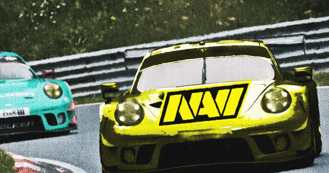 A Porsche race car branded with the Natus Vincere logo. It is driving on a race track, approaching the camera.
